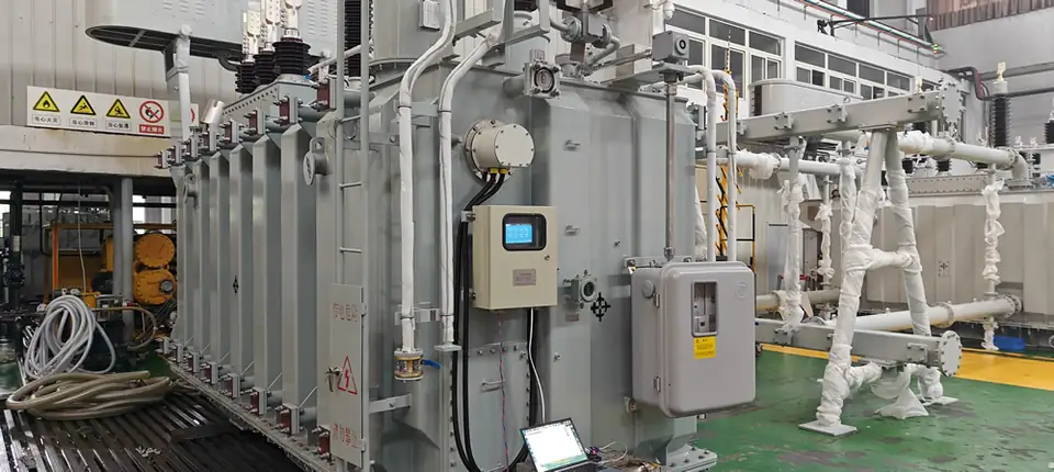 Online monitoring arrangement for a 110 kV hybrid-insulated oil transformer