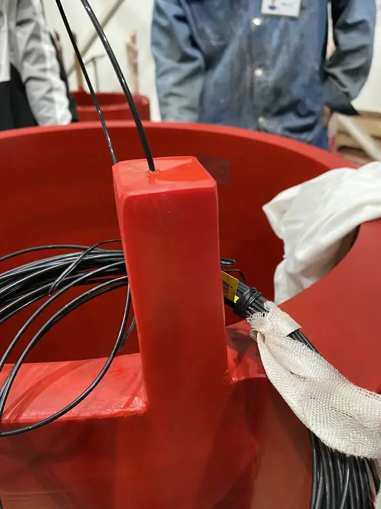 Fiber optic temperature probes routed on a dry-type transformer winding