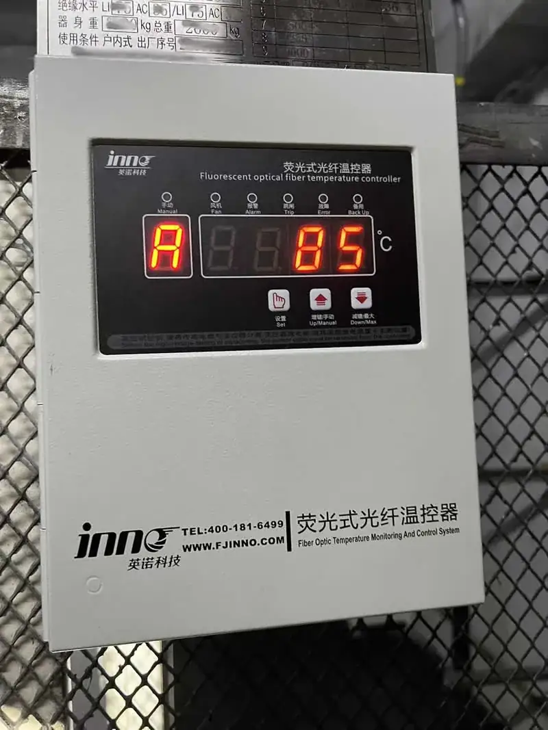 INNO fluorescent fiber optic temperature controller installed beside a dry-type transformer