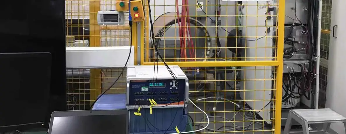 High-voltage test setup with fiber optic monitoring equipment