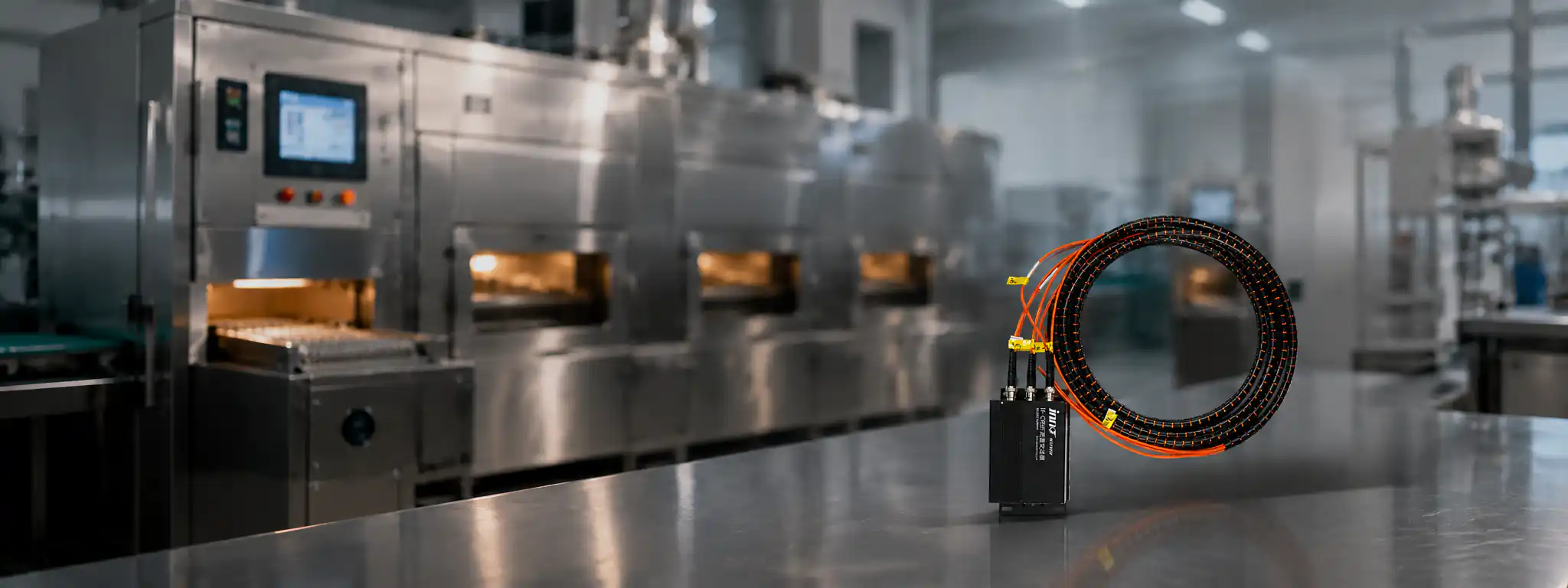 Industrial microwave processing line with fiber optic temperature monitoring